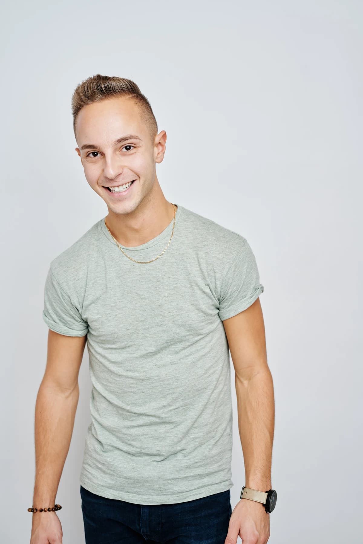 Jordan smiling at the camera in a pale green shirt.