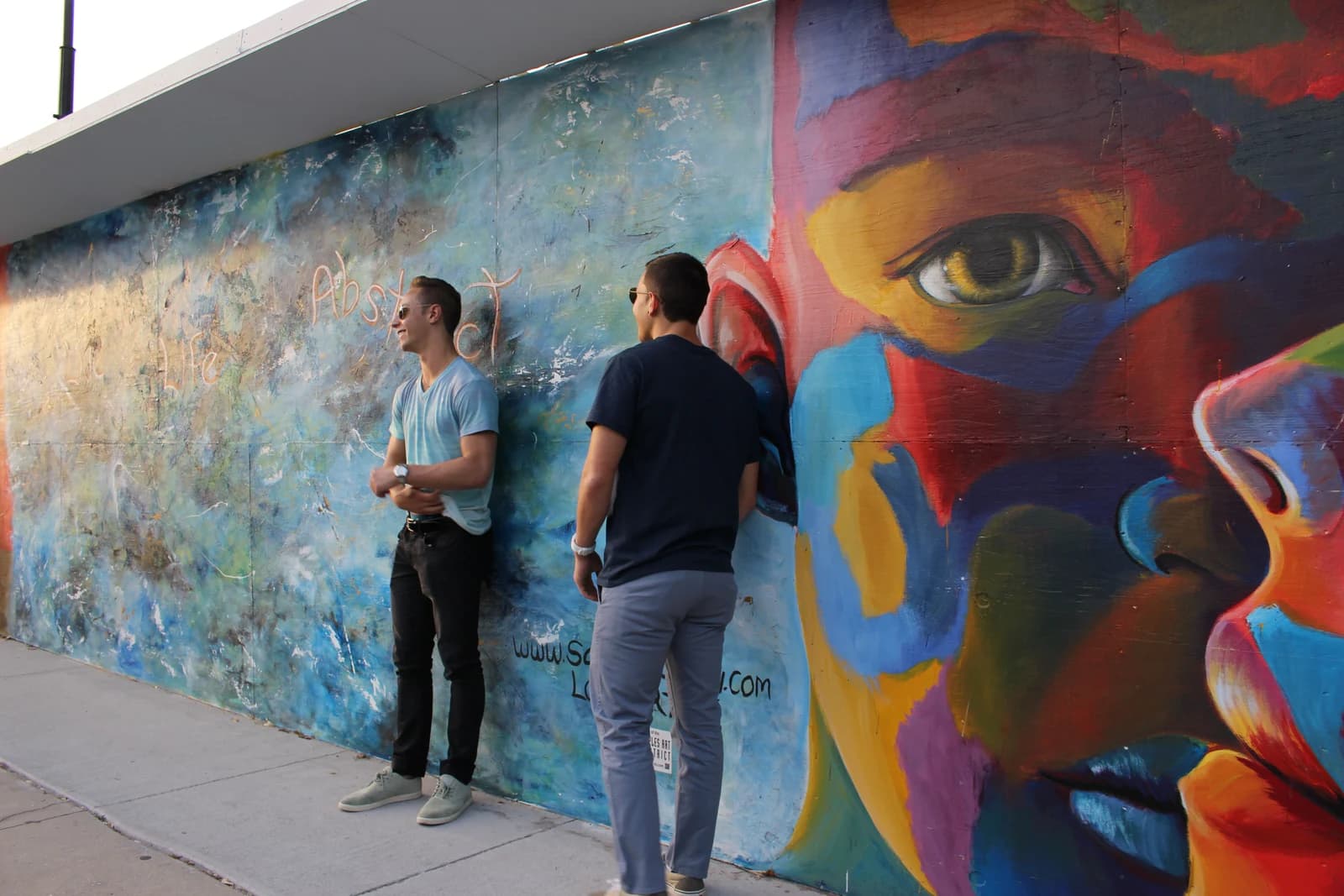 Jordan and Patrick together beside the Naples mural.