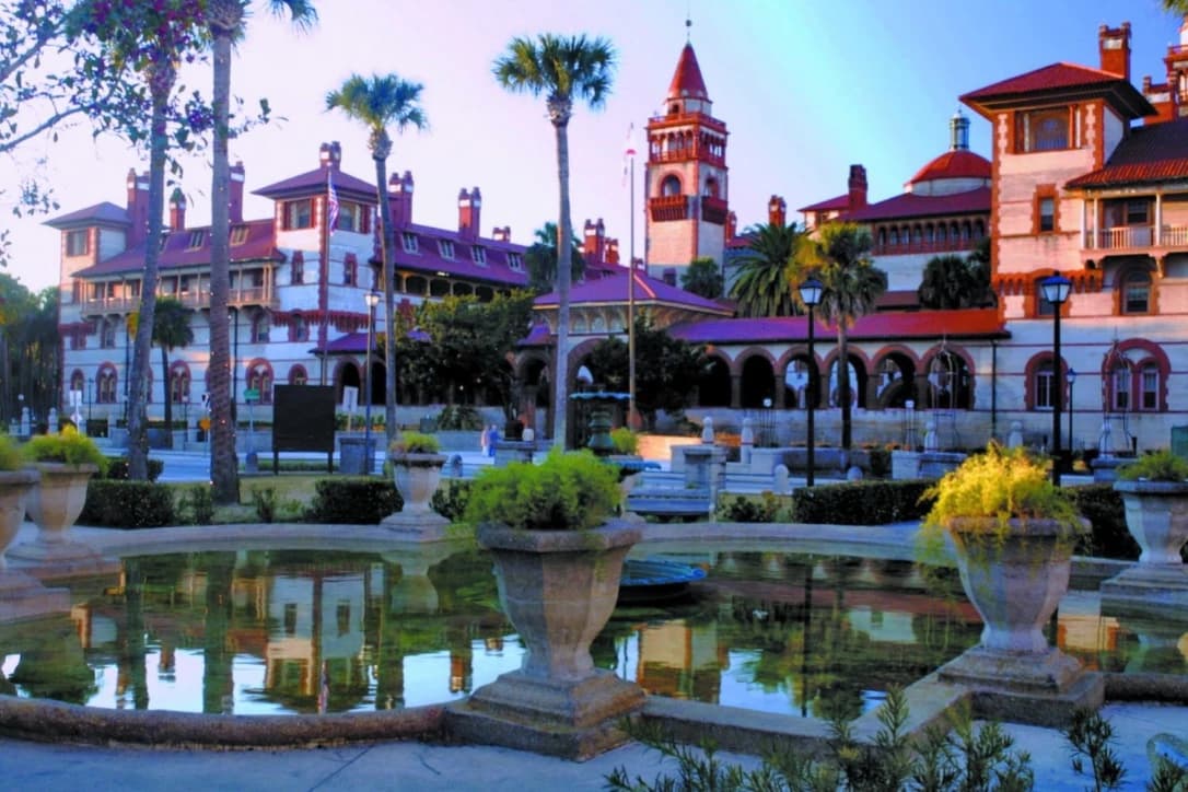 Palm trees, towers and the reflecting pool at Flagler College.