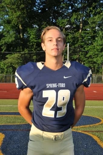 Jordan in his navy and gold Spring-Ford number 29 football uniform.